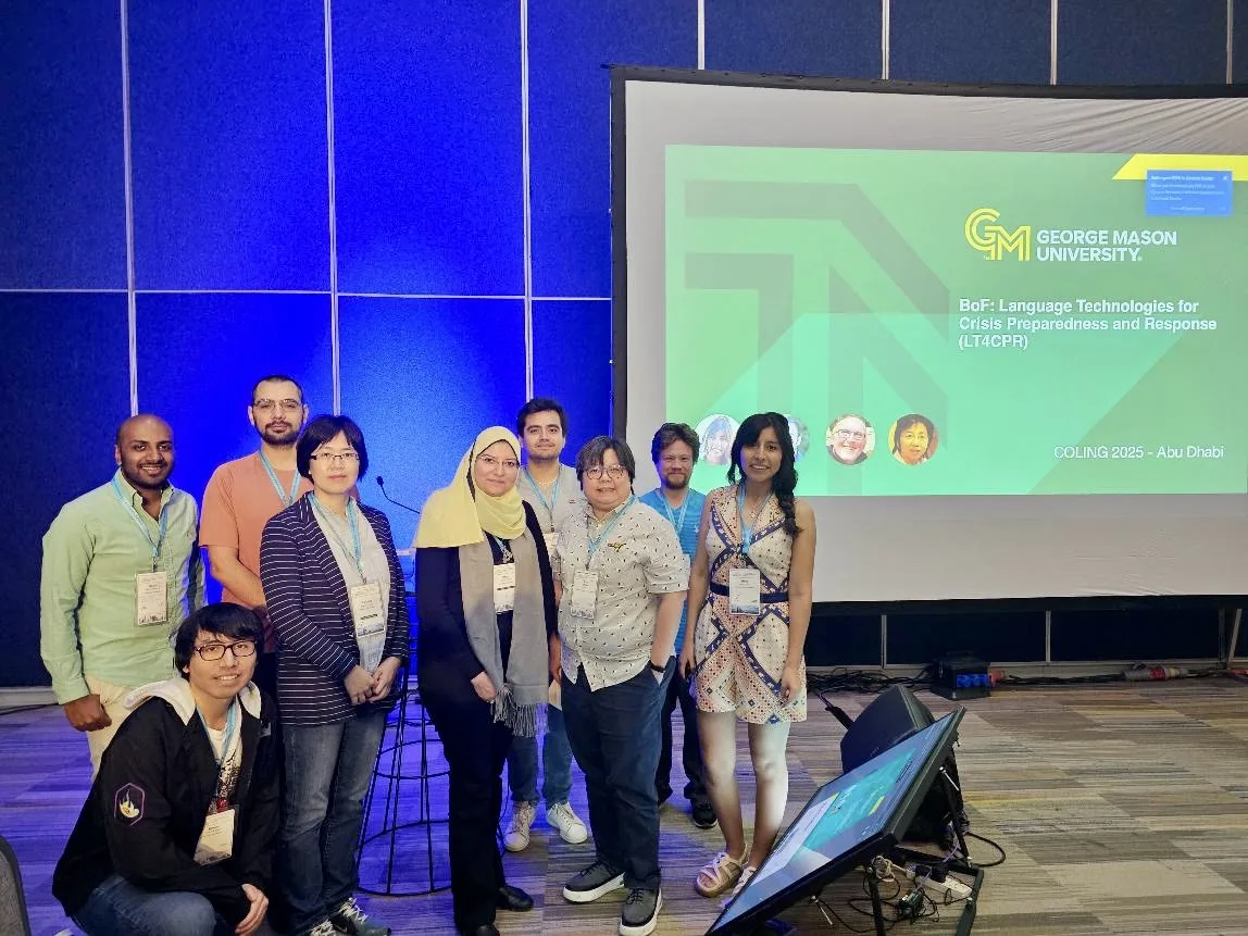 Participants standing in front of the LT4CPR presentation screen at COLING 2025